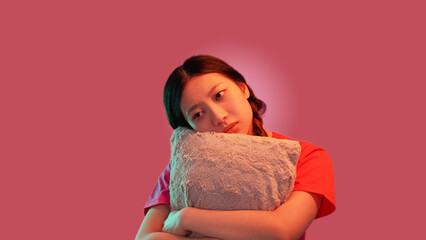 Sadness suffer. Feel lonely. Sleepless melancholy. Upset depressed woman hugging pillow...
