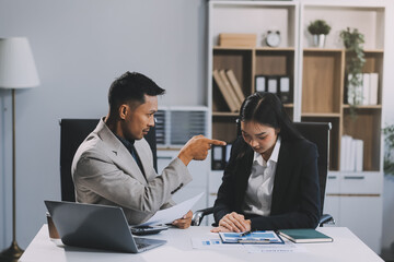 Manager is hard talking with employee in an office. Businessmen arguing at workplace, disagreeing over document, partners having conflict while negotiating, business deal failure