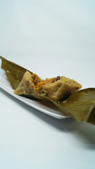 Traditional wrapped rice dumpling or zongzi on a plate