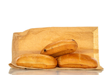 Three sweet buns with paper bag, macro, isolated on white background