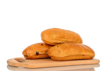 Three sweet buns on a wooden kitchen board, macro, isolated on white background