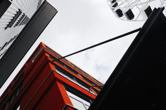Urban background with ferris wheel and exterior building facade in Munich,  Germany