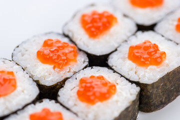 Sushi set and composition at white background. Japanese food restaurant, sushi maki gunkan roll plate or platter set.