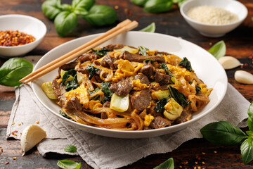 Thai Pad See Ew with beef, eggs, vegetables and rice noodles.