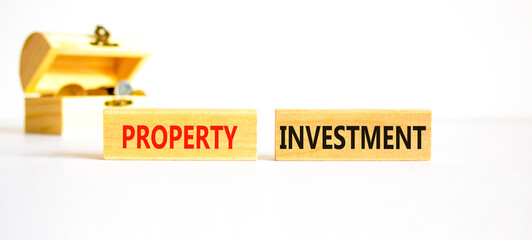 Property investment symbol. Concept words Property investment on beautiful wooden block. Beautiful...