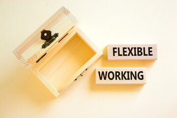 Flexible working symbol. Concept words Flexible working on beautiful wooden block. Beautiful white...