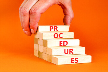 Procedures symbol. Concept word Procedures on beautiful wooden blocks. Businessman hand. Beautiful...
