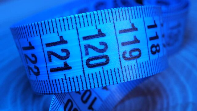 blue measuring tape with colorful light effects. 4k video capture
