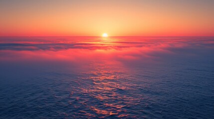 Obraz premium sunset sunrise over blue ocean with orange yellow red purple gradient clouds aerial photography scenic view
