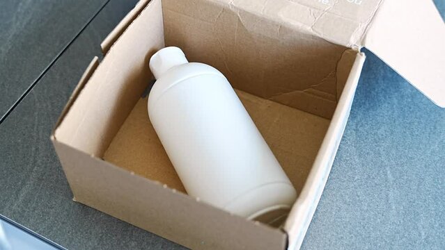 Eco packaging of parcels and white biodegradable filler. Box is filled with a filler safety for environment. Delivery of goods, parcels, delivery service, nature protection and recycling concept