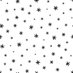 Small black snowflakes isolated on a white background. Monochrome seamless pattern. Vector simple flat graphic hand drawn illustration. Texture.