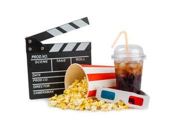 Tasty popcorn in buckets and cold cola drinks with cinema tickets, movie clapper and 3D eyeglasses...