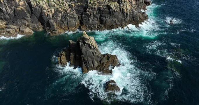 Cliff in the ocean. Beautifull sea water. Cornwall. Cinematic drone flight