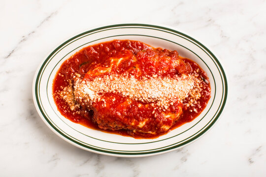 Overhead of plate of pasta on marble surface