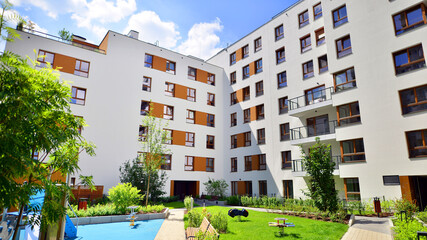 European residential architecture harmonizing with nature. Eco-friendly living in city with greens....