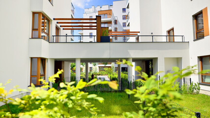 European residential architecture harmonizing with nature. Eco-friendly living in city with greens. Eco apartment building saving energy and fresh air concept. 