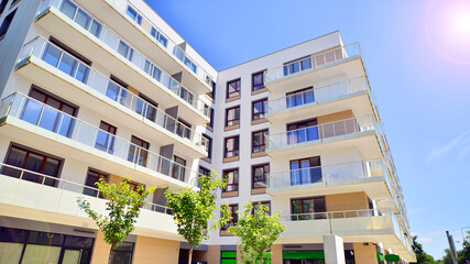 European residential architecture harmonizing with nature. Eco-friendly living in city with greens. Eco apartment building saving energy and fresh air concept. 