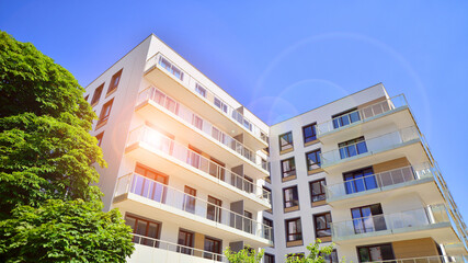 European residential architecture harmonizing with nature. Eco-friendly living in city with greens. Eco apartment building saving energy and fresh air concept. 