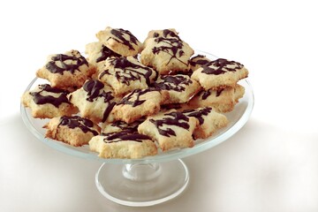cookies coconut flakes flour and chocolate icing
