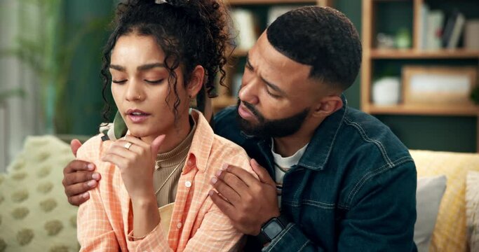 Infertility, pregnancy test and sad with couple on sofa in living room of home together for comfort. Disappointed, failure or results with man and woman in apartment for depression or frustration