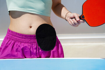 Close-up person with stoma bag in the belly doing sport