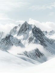 Fototapeta premium Snow-covered mountain range with sharp, jagged peaks. Misty clouds hover around the peaks, creating a serene and ethereal atmosphere under a pale blue sky.