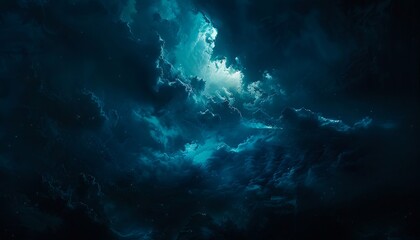 A dark cloudy sky with a bright light.