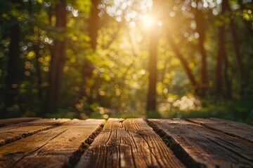 Wooden table top with blurred background of sunlight filtering through trees in a forest for product display montage, conveying a summer nature concept.