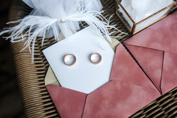 Wedding photography, top view of accessories, details of the bride: envelope, sheet of white paper,...