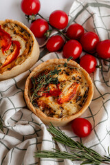 Rustic Tomato and Herb Tart with cherry tomatoes and rosemary, perfect for a veg meal