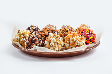 Handcrafted Candy Bar Popcorn Balls with Peanut Crunch