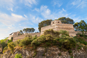 The medieval defense walls of the Royal Palace on The Rock, in the old town of Monaco Ville, or...