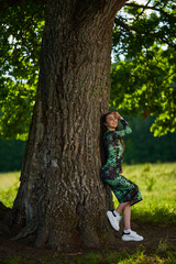 Beautiful Hispanic woman in oak forest