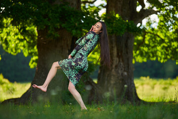 Beautiful Hispanic woman in oak forest