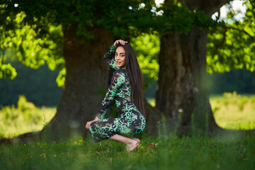 Beautiful Hispanic woman in oak forest