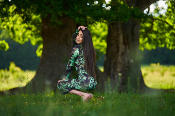 Beautiful Hispanic woman in oak forest