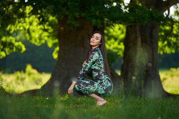 Beautiful Hispanic woman in oak forest