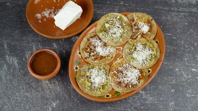 Mexican clay plate with chalupas poblanas, Travel shot left