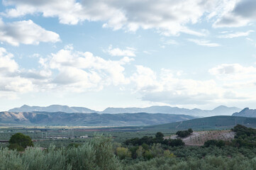 Scenic mountain landscape with cloudy sky in the distance