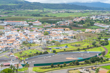 Aerial view of the oval-shaped municipal sports field near the bay and beach of Vitoria, Terceira island-Açores-Portugal.