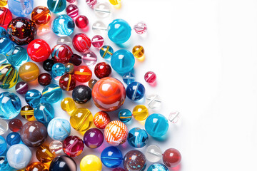 A bunch of colorful glass beads are scattered on a white background