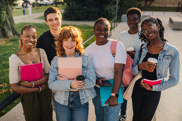 Portrait of diverse group of college students at campus smiling at camera