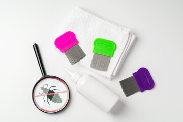 Medicine, lice comb and magnifying glass isolated on white