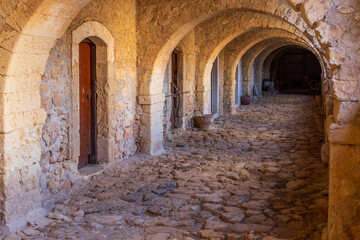 Europe, Greece, Crete, Rethymno. Venetian Baroque, 16th C. Eastern Orthodox Monastery.  The Holy Monastery of Arkadi. Stone hallway.