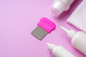 Anti lice combs and towel on pink background