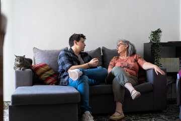 Son Having a Conversation with His Mother on the Couch