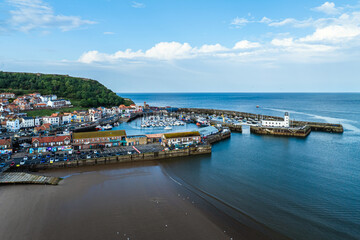 Scarborough Lighthouse and Harbour from a drone, Vincent Pier, Scarborough, North Yorkshire, England, Europe