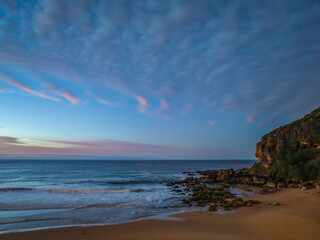 Winter seascape views over the beach with high and medium cloud cover