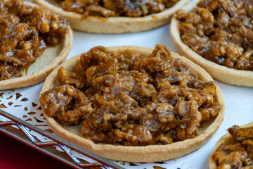 Walnuts tart cake form Perigord, Dordogne, fresh baked nuts cake on local farmers market in Saplat-du-Caneda, Perigord, France