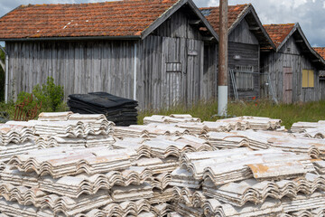 Travelling in France, old wooden huts and oysters farms in Gujan-Mestras village, cultivation and sale of fresh oysters seashells, Arcachon bay, Atlantic ocean, France, tourists destination